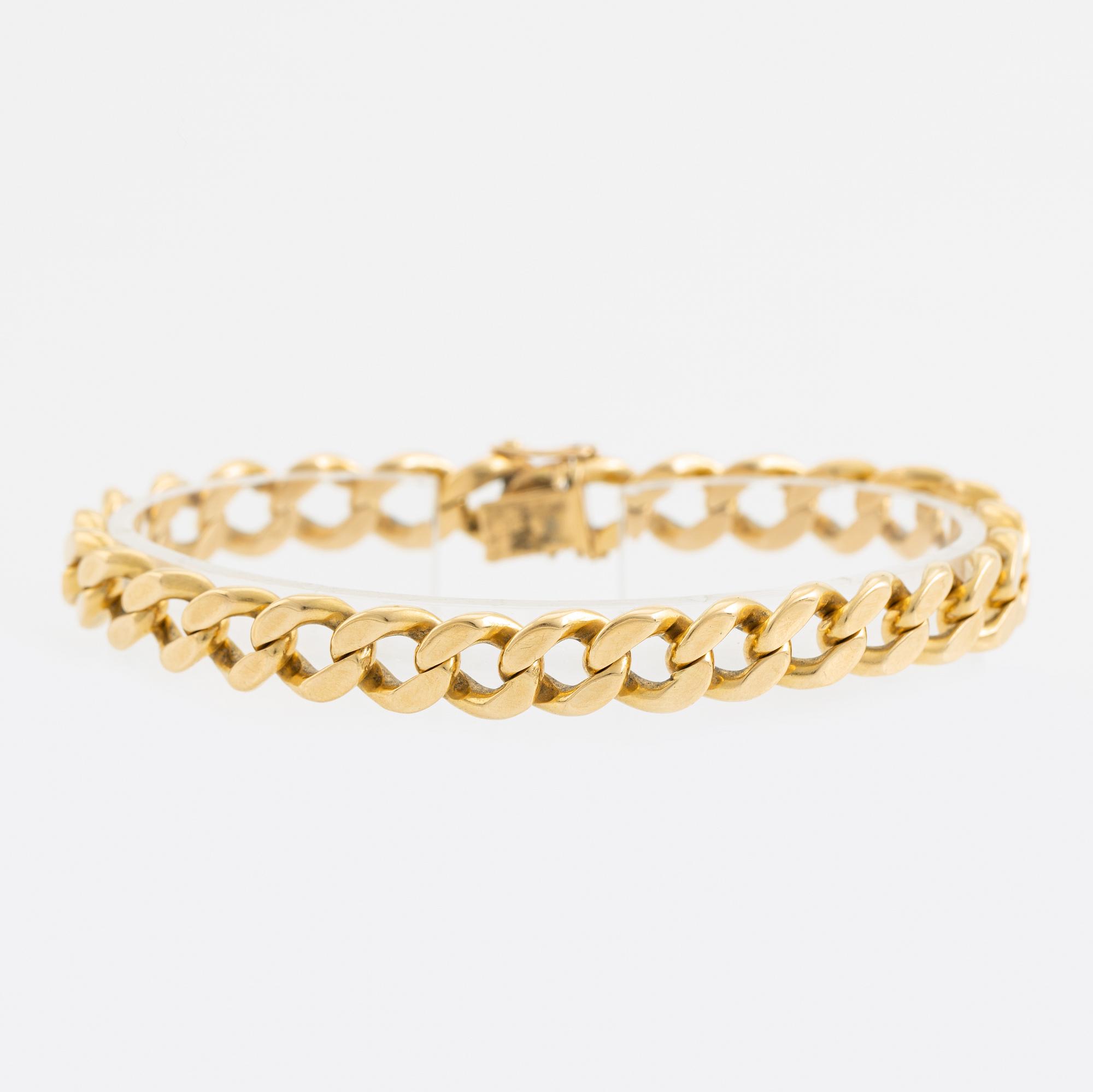 18K gold curb link bracelet.