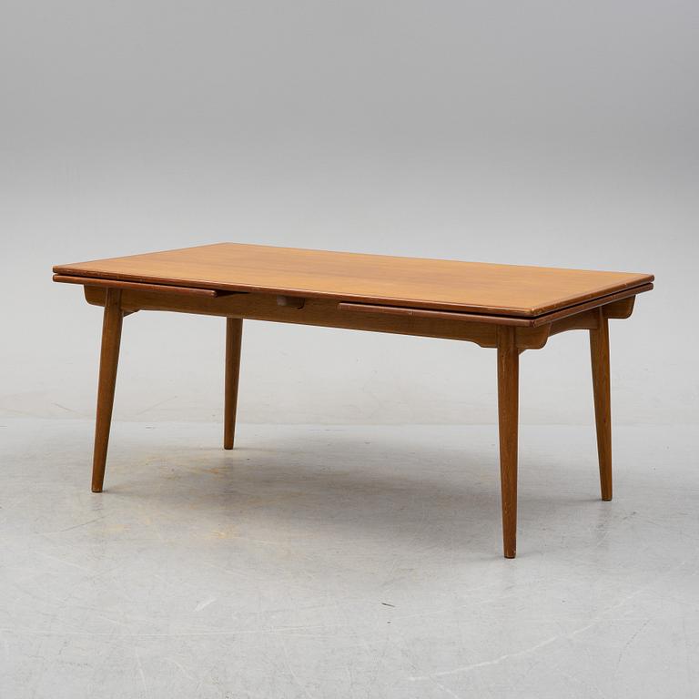 Hans J Wegner, a model 'AT-312' teak veneered dining table, Andreas Tuck, Denmark.