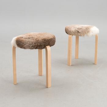 A pair of decorative stools, model 60 for Artek 2010. Upholstery design Ilse Crawford.