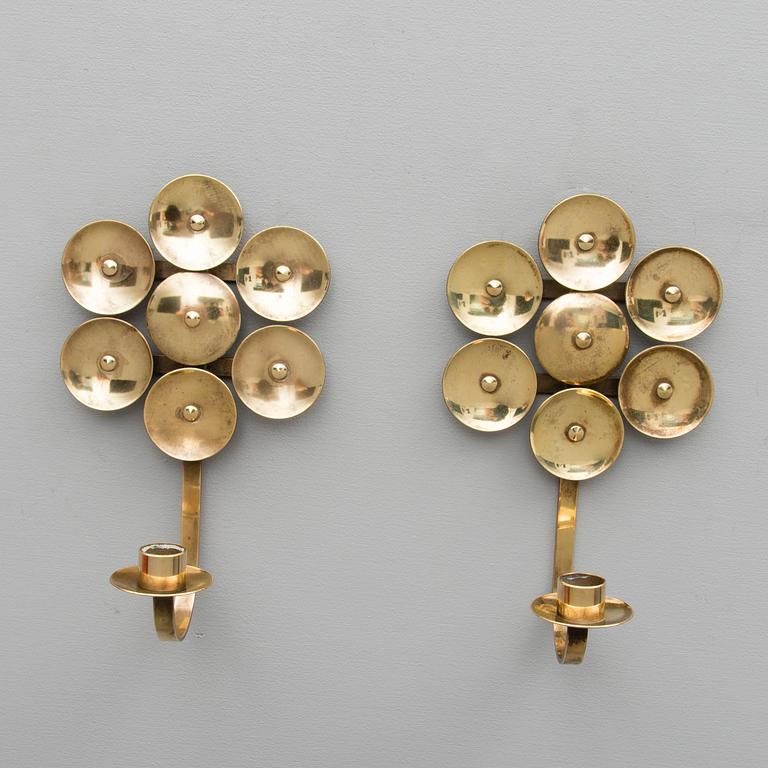 A Pair of Mid Century Swedish Brass Candle Holders by Mora KEE.