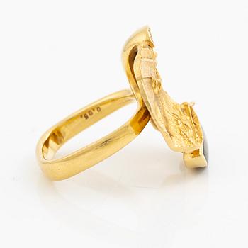 A ring, 18K gold with a fancy-cut smoky quartz and round brilliant-cut diamonds.