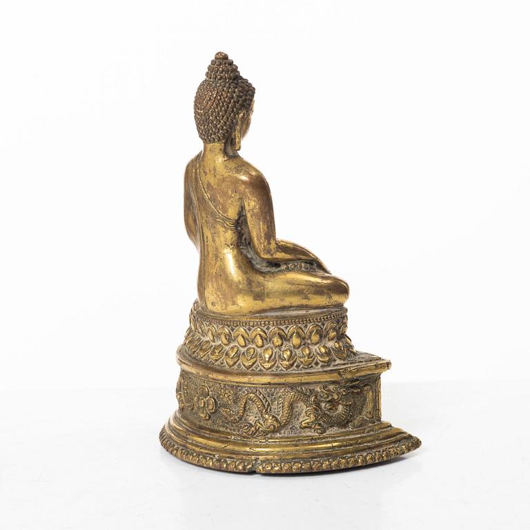 A gilt bronze figure of a Buddha, Nepal, 20th century.