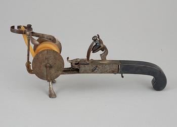 A steel flintlock tinderlighter circa 1800.