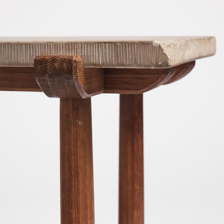 Axel Einar Hjorth, a stained pine and limestone top "Sandhamn" table, Nordiska Kompaniet, Sweden 1931.