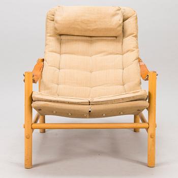 BROR BOIJE, A pair of 'Junker' easy chairs and an ottoman for Dux, Sweden, latter half of the 20th Century.