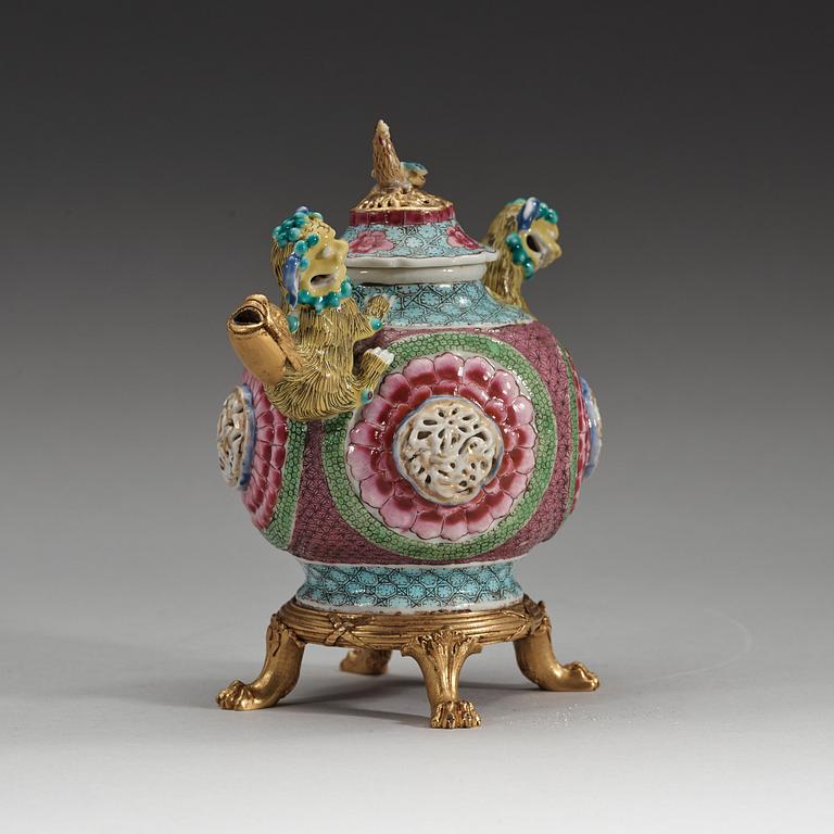 A gilt bronze mounted famille rose tea pot with cover, Qing dynasty, Yongzheng (1723-35).