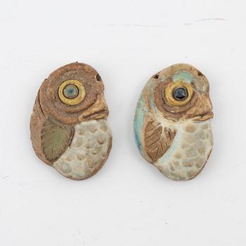 Tyra Lundgren, two stoneware pendants.
