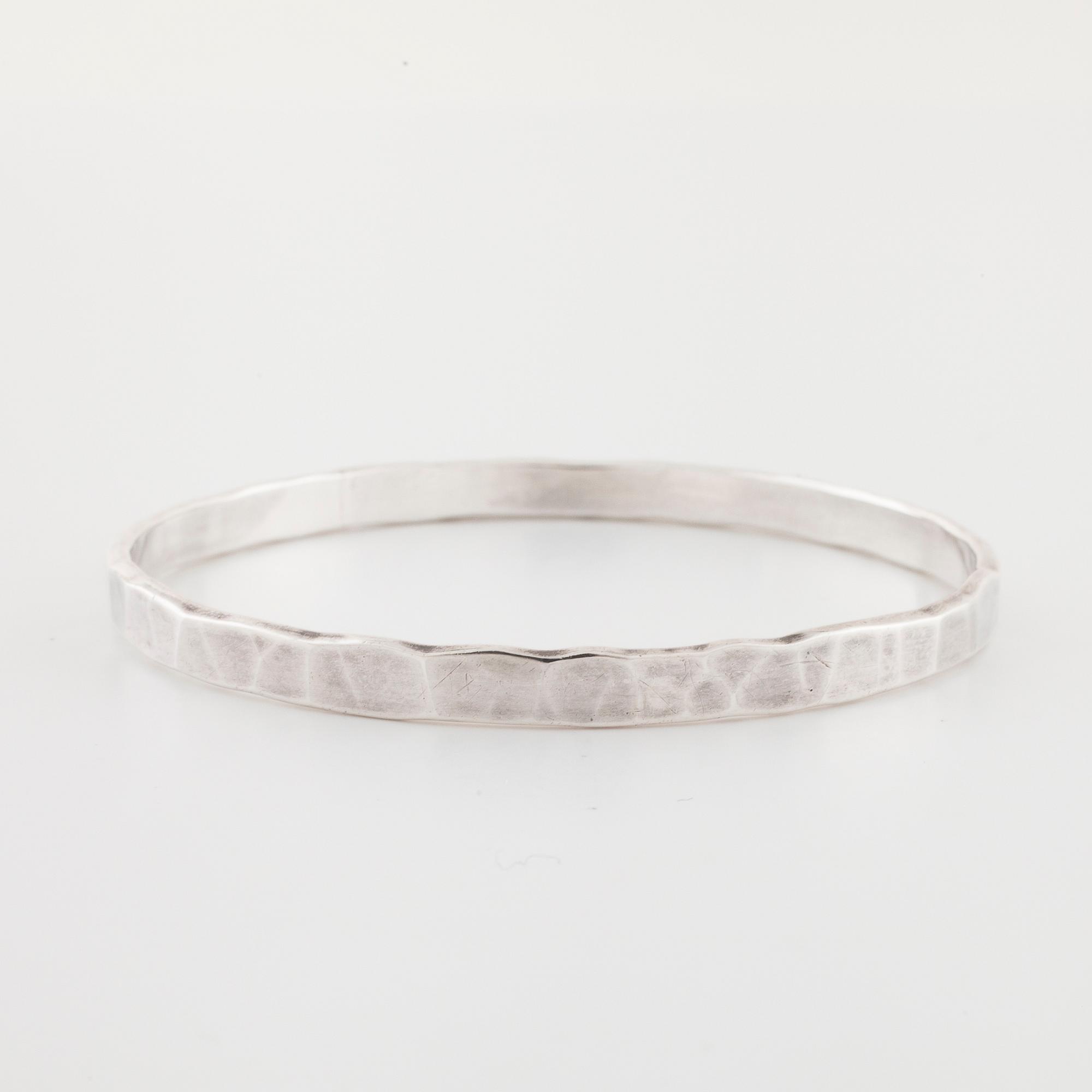 GÖRAN KUHLIN, Göteborg, 1990, en armring.