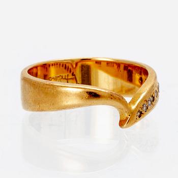 An 18K gold ring with octagonal cut diamonds.