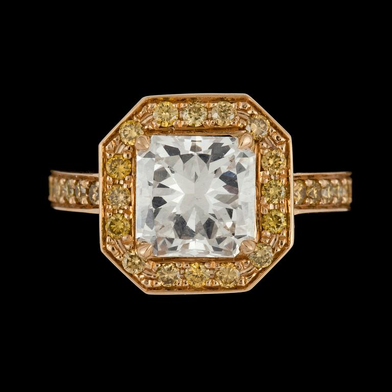 A radiant cut diamond, 2.12 cts, and small yellow diamonds total carat weight circa 0.50 ct.