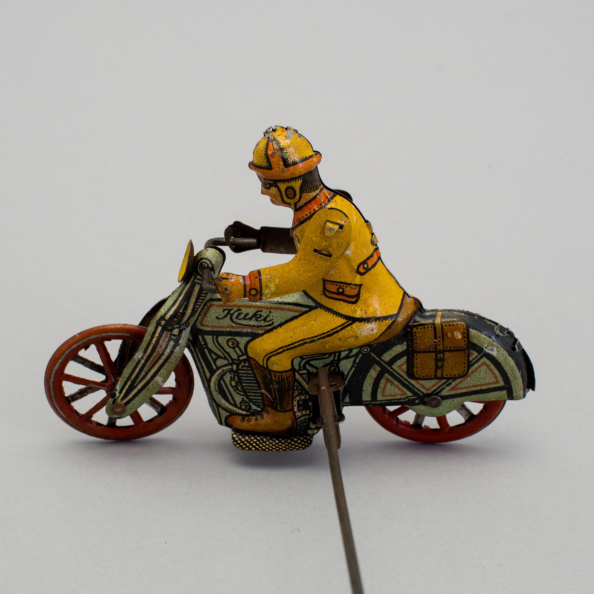 A tinplate Huki roundabout motorcycle, Germany, 1930s.