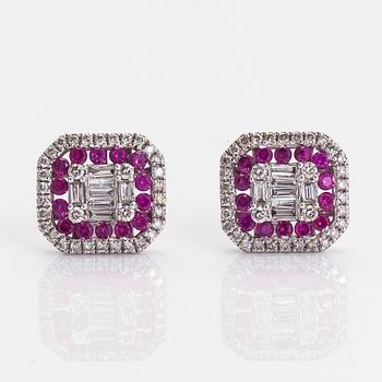 A pair of 18K white gold earrings, with rubies and diamonds.