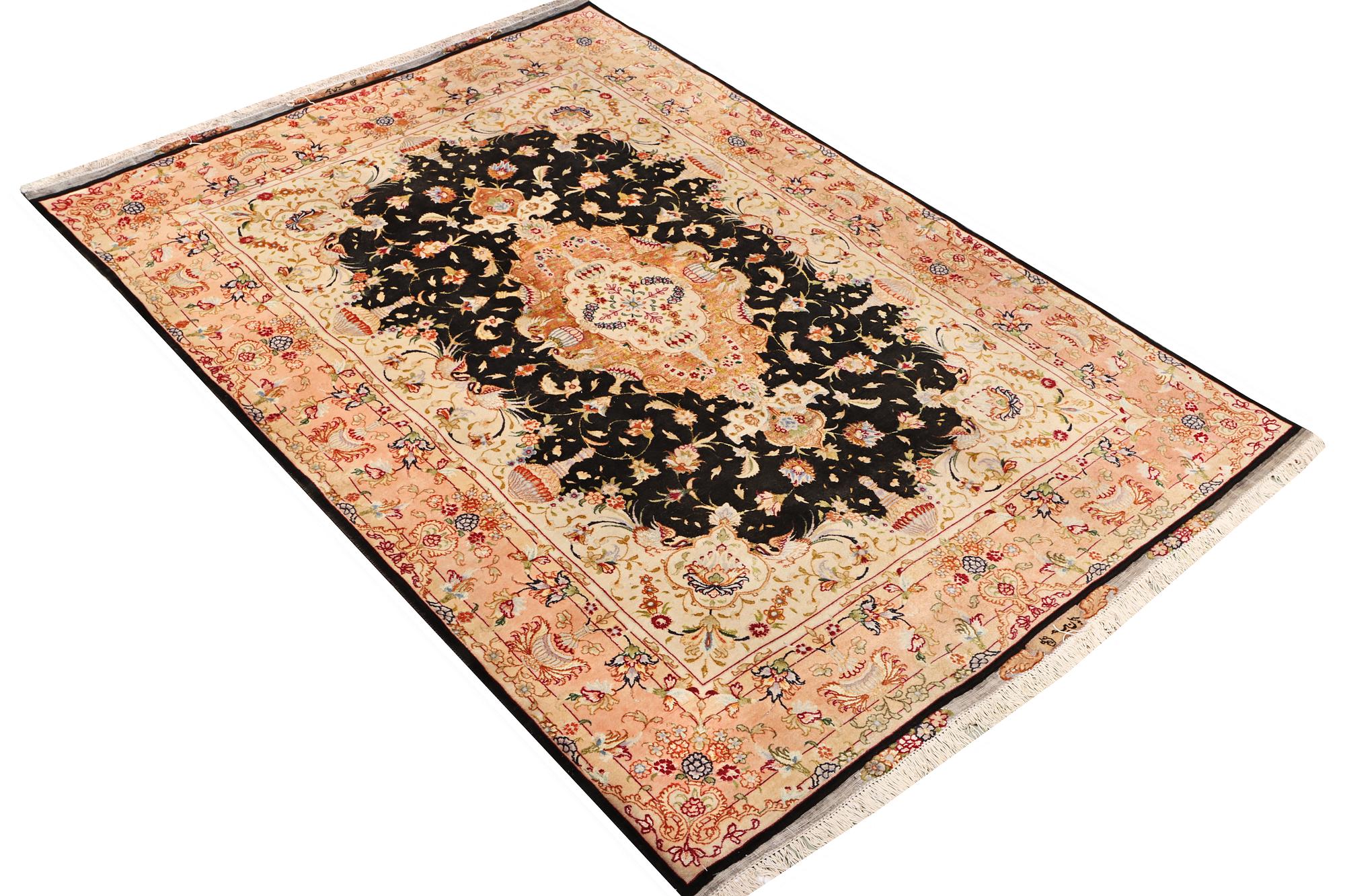 A Tabriz rug, a. 210 x 147 cm.