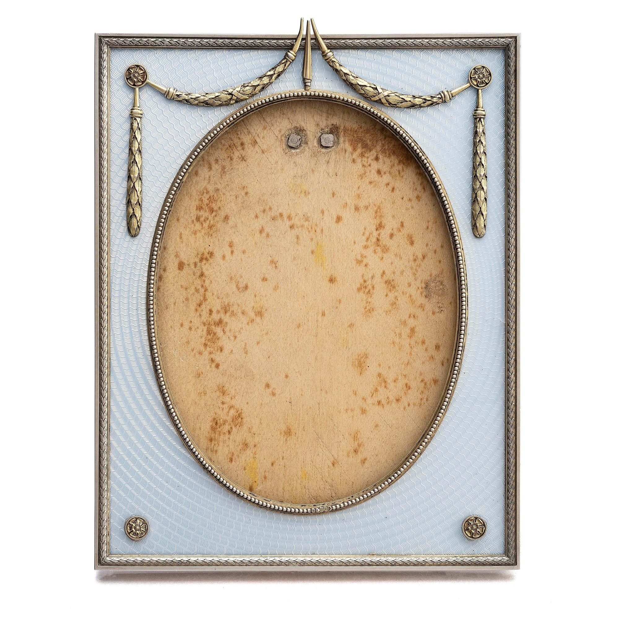 A Fabergé parcel-gilt silver and enamel frame, workmaster Antti Nevalainen, St Petersburg 1899-1908.