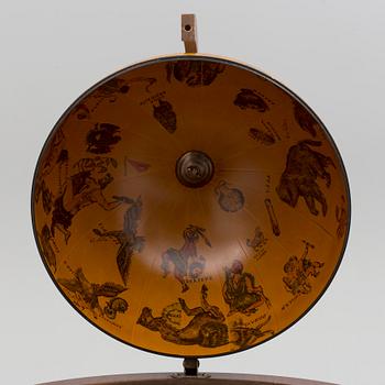 A globe shaped drinks cabinet, circa 2000.