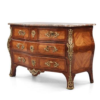 5. A Louis XV ormolu-mounted amaranth and rosewood marble top commode, mid 18th century.