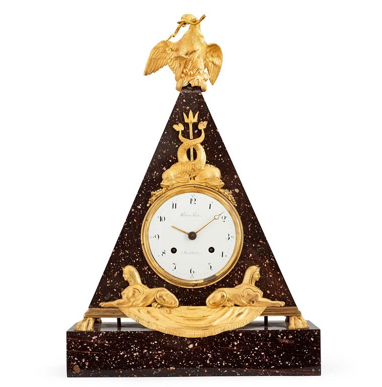 A late Gustavian early 19th Century porphyry and gilt bronze mantel clock.