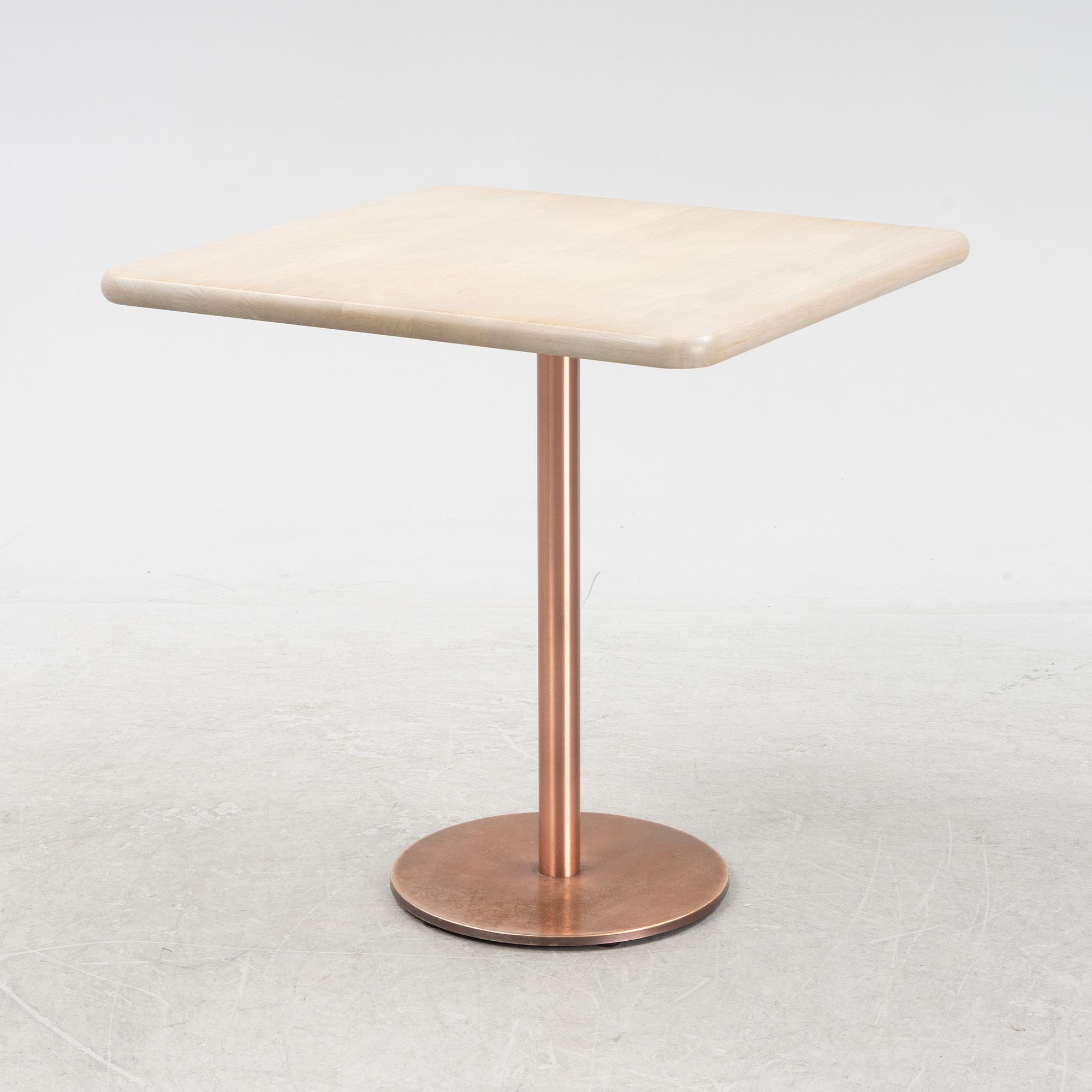 A steel and oak table by Jonas Lindvall 2011.