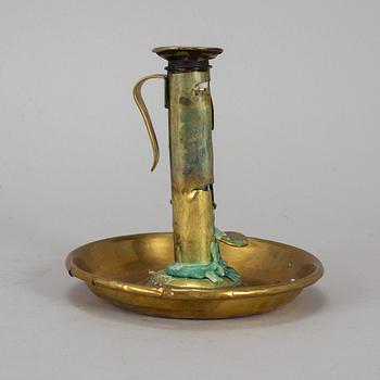 A 19th century brass night light holder.