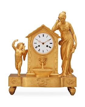 796. A French Empire early 19th century mantel clock.