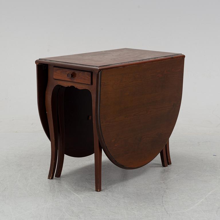 A stained pine gate-leg table, Åmells möbler.