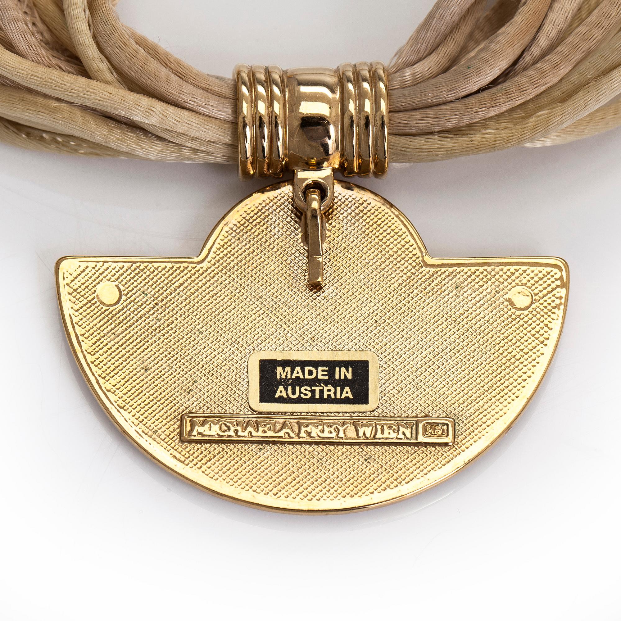 Michaela Frey, armband och halssmycke, förgylld metall, emalj.