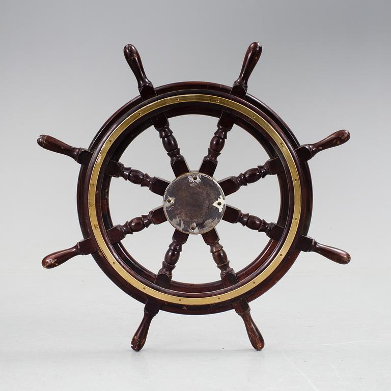 A ship steering wheel by John Hastle& Co Greenock, England, early 20th century.