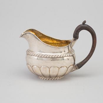 A Russian parcel-gilt cream jug, maker's mark Erik Frisk, St Petersburg, 1826.