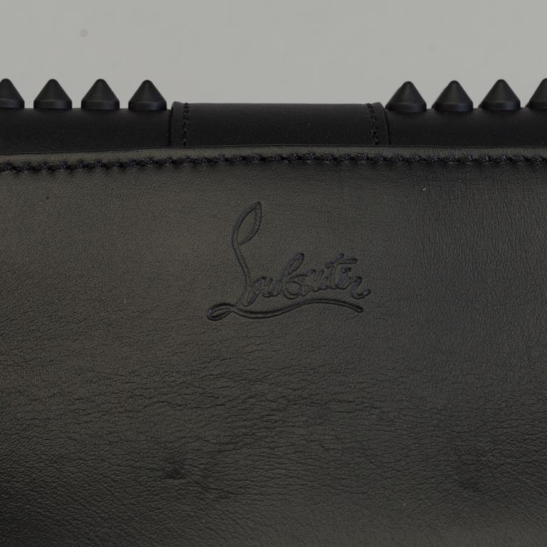 An eveningbag with studs by Christian Louboutin.