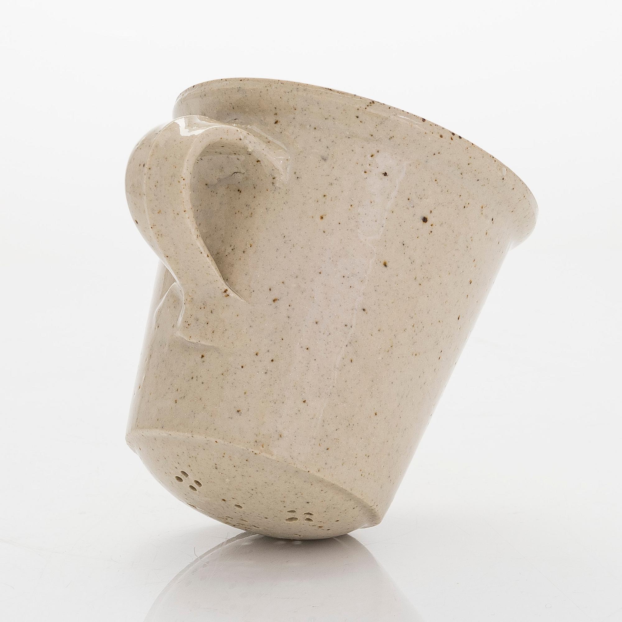 Kyllikki Salmenhaara, a stoneware tea strainer signed KS.