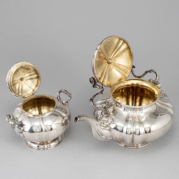 A silver teapot and sugar bowl, maker's mark of Carl Bojanowski, St. Petersburg 1851-57.