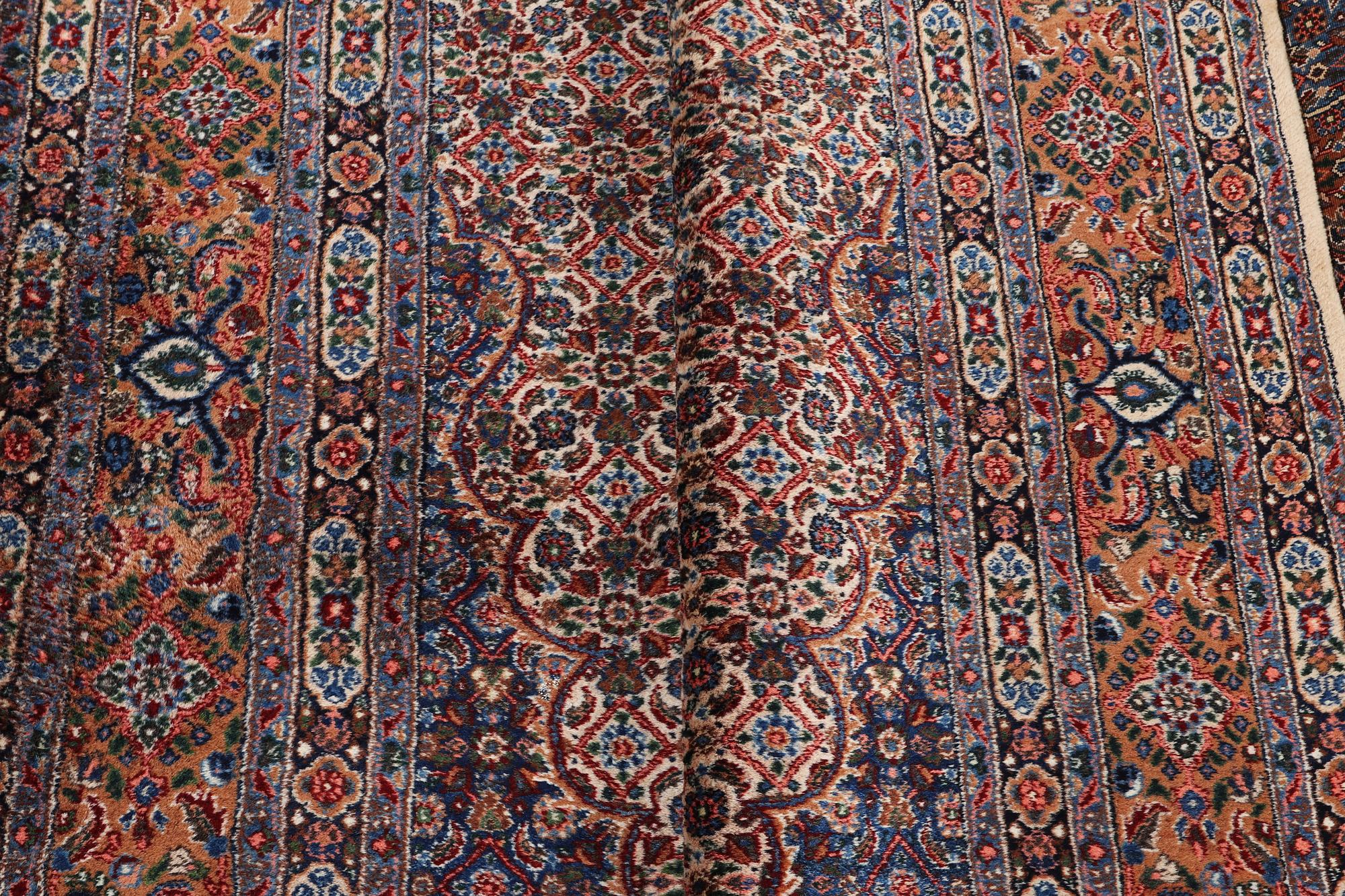 A carpet, Moud, signed, ca 385 x 268 cm.