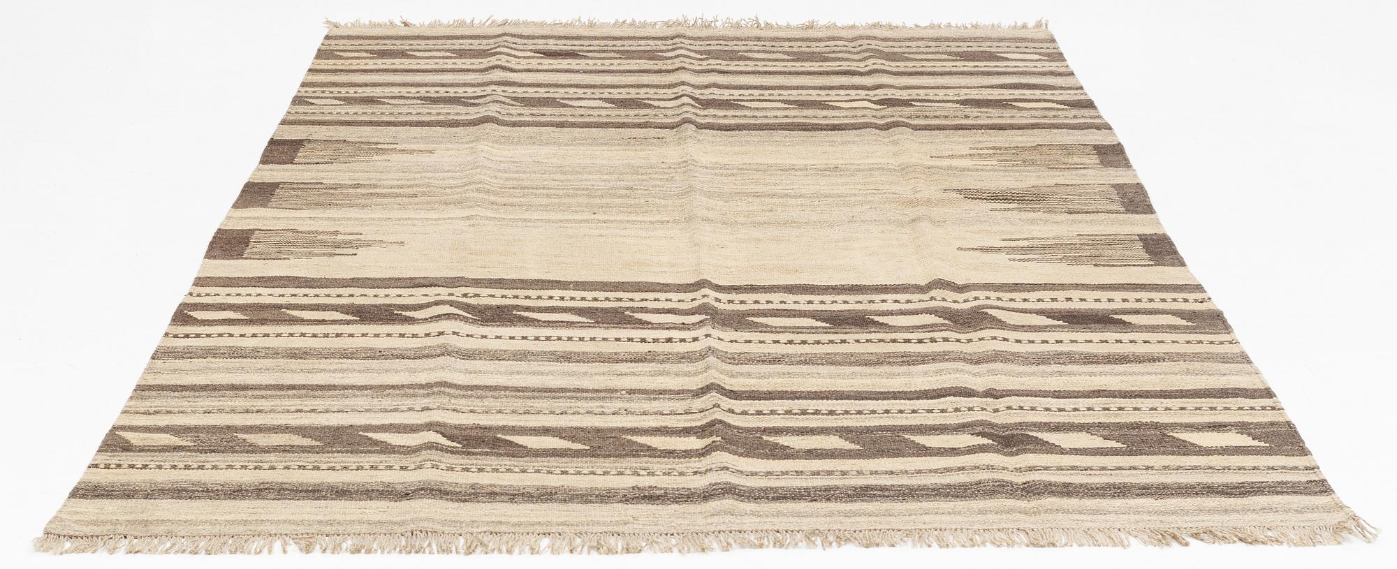 A persian kilim, ca 300 x 200 cm.