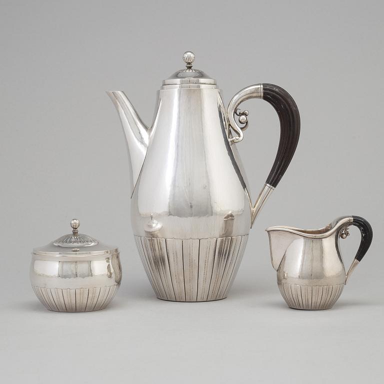 A three piece sterling silver coffee service "Cosmos" design Johan Rohde for Georg Jensen, Copenhage.