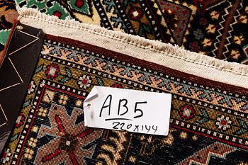 A rug, Sarouk, c. 220 x 144 cm.