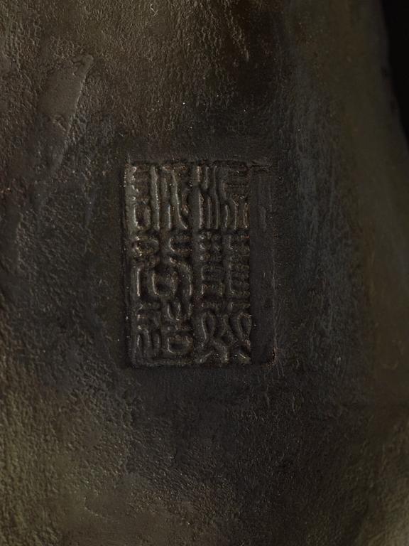 A large Japanese bronze sculpture of an elephant attacked by tigers, with seal mark, Meiji, circa 1900.