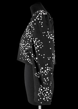 A black bolero by Yves Saint Laurent.