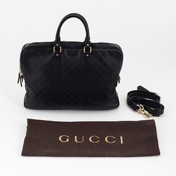 Gucci, a briefcase.