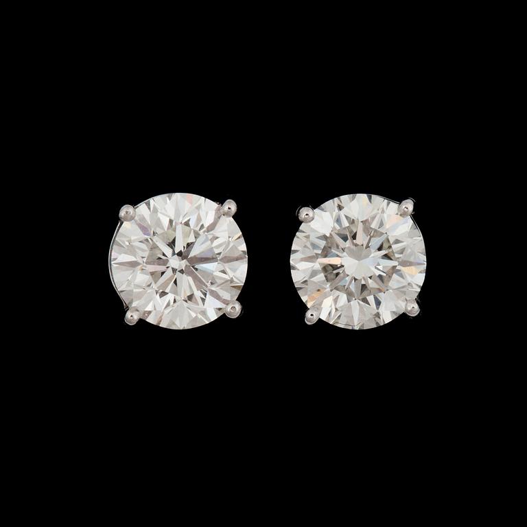 A pair of diamond, 2.00 cts and 2.00 cts G-H/VS2, earrings.