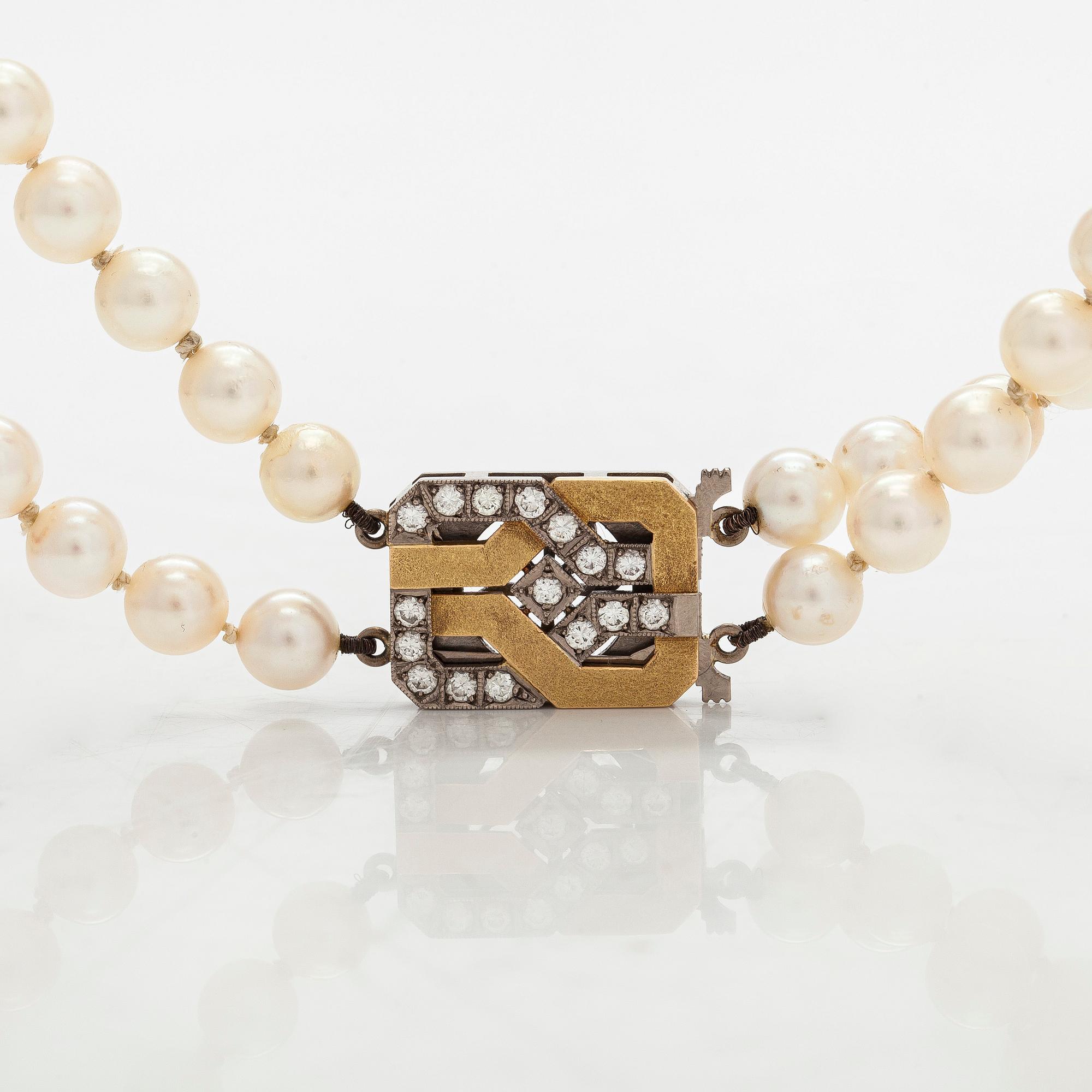 Pärlcollier, lås 18K guld med diamanter. St Eriks Silversmedja, Stockholm, 1987.