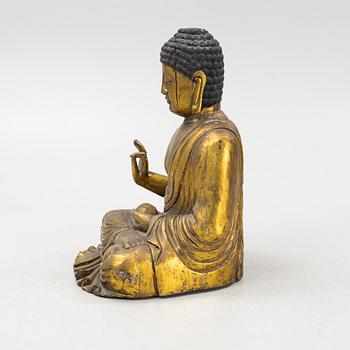 A massive gilded wooden figure of buddha, 20th century.