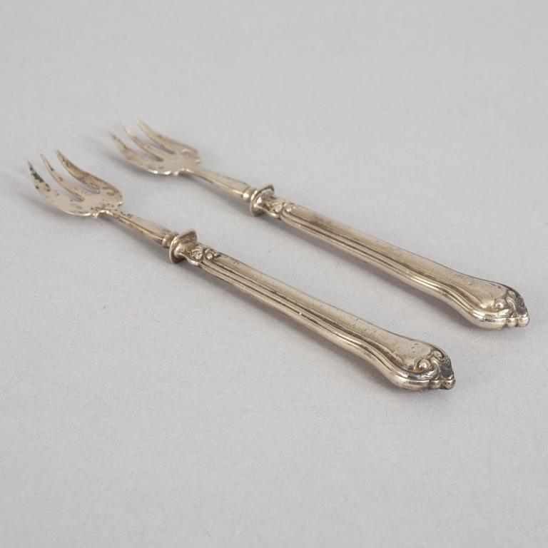 A set of twelve French 19th century silver oyster forks, mark of Hippolyte Thomas, Paris.