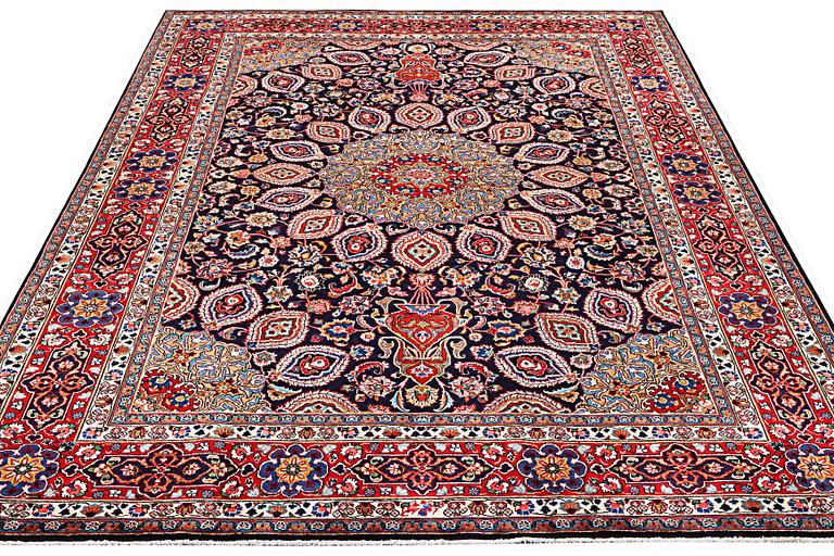 A Meshed carpet, c. 352 x 255 cm.