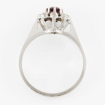Ring, cameo model, 18K white gold with small diamonds and red-toned stone,.