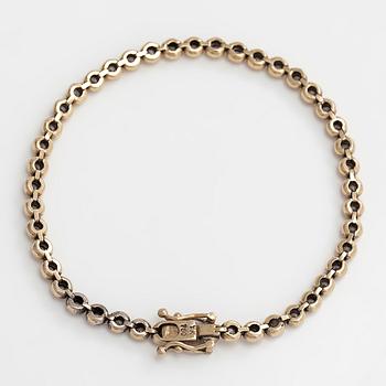 Tennisrannekoru, 18K kultaa ja timantteja yhteensä noin 0.78 ct.