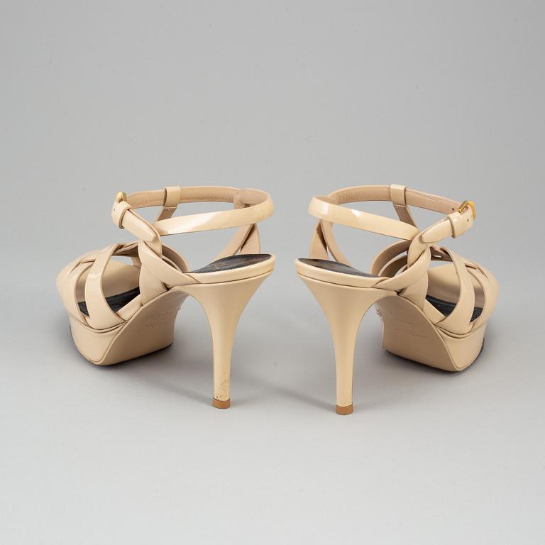 YVES SAINT LAURENT, a pair of open toe patent leather shoes, size 36½.
