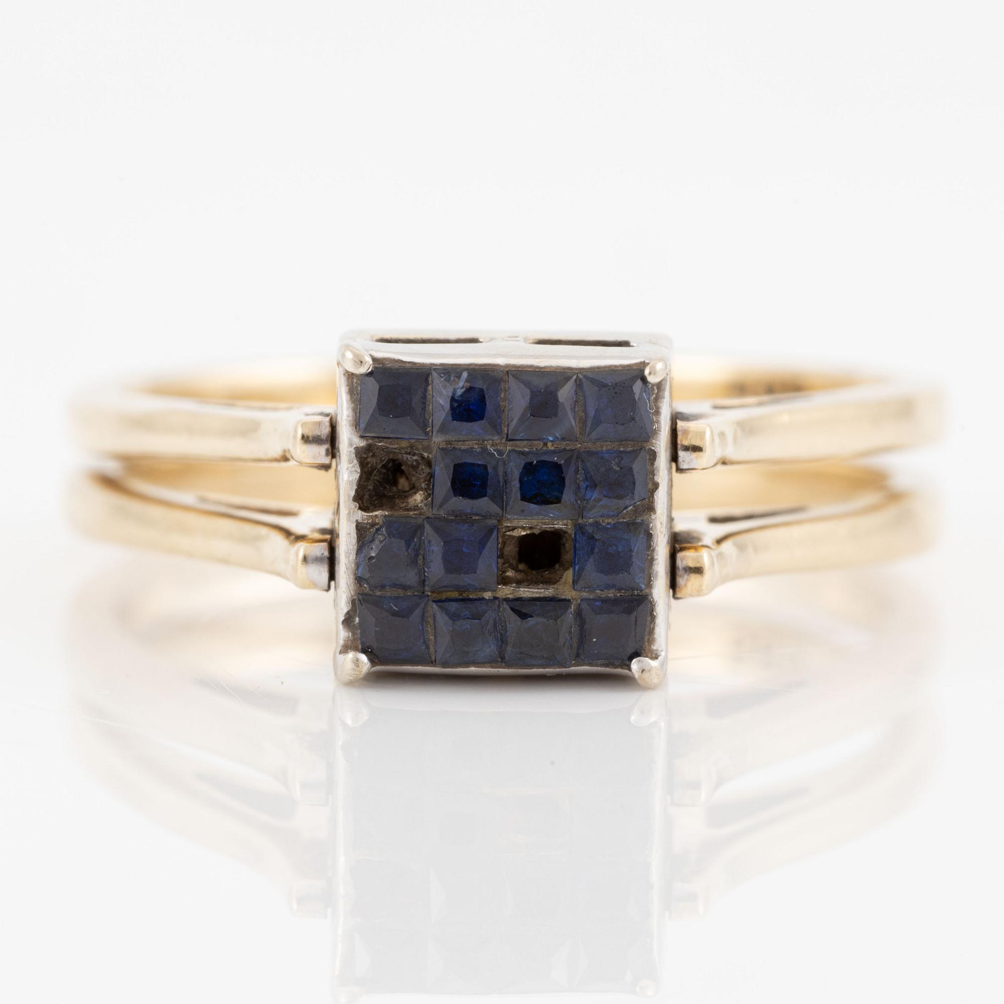 Ring in 14K gold set with princess-cut diamonds and blue stones.