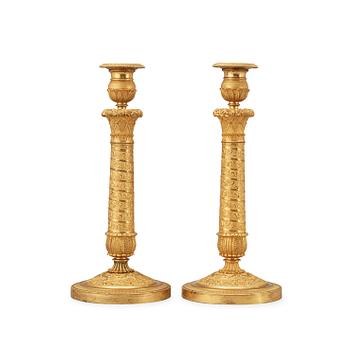 1625. A pair of French Empire early 19th century candlesticks.