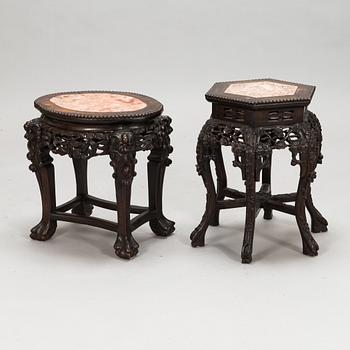 Two Chinese carved wood side tables, 20th Century.