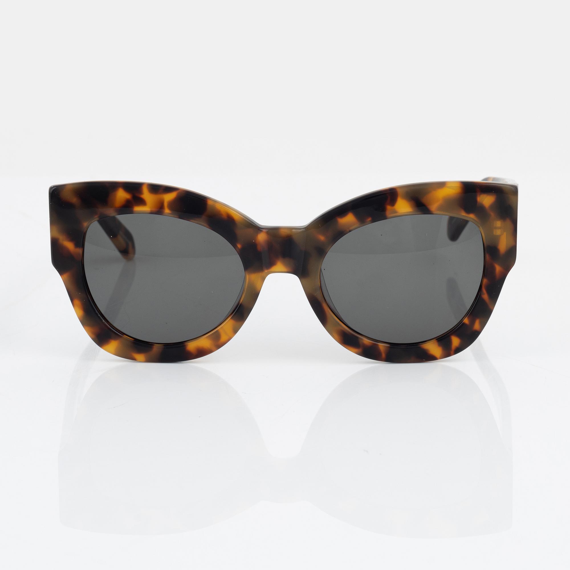 Karen Walker, a pair of tortoise "Northern lights" sunglasses.